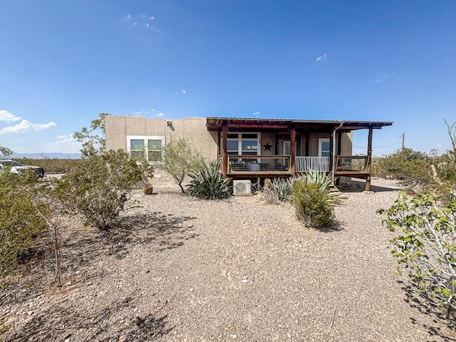 1500 Rancho Rd, Presidio, TX 79845 - back of house featuring a porch and stucco siding