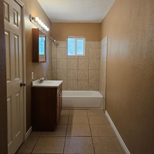 801 W Golf Course Rd, Midland, TX 79701 - full bathroom featuring tile patterned flooring, vanity, tub / shower combination, baseboards, and a textured wall