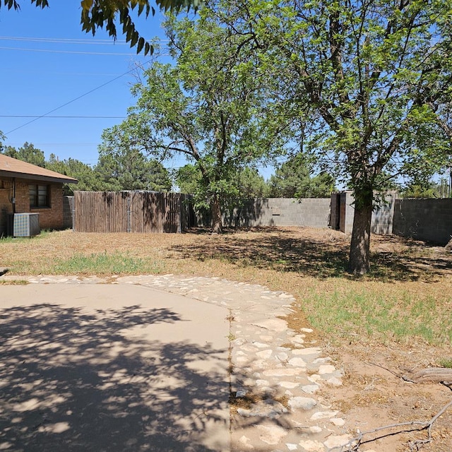801 W Golf Course Rd, Midland, TX 79701 - view of yard with central AC unit