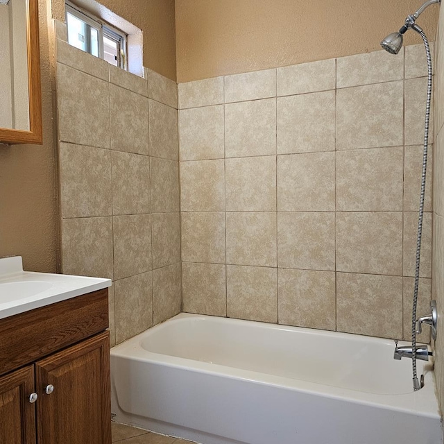 801 W Golf Course Rd, Midland, TX 79701 - bathroom with a textured wall, vanity, and shower / washtub combination