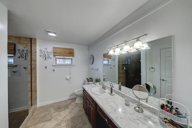 104 E 3rd St, Marfa, TX 79843 - bathroom featuring tile patterned flooring, vanity, a wealth of natural light, and tiled shower