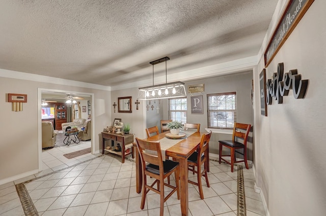 104 E 3rd St, Marfa, TX 79843 - dining room with baseboards, ceiling fan, a textured ceiling, and light tile patterned flooring