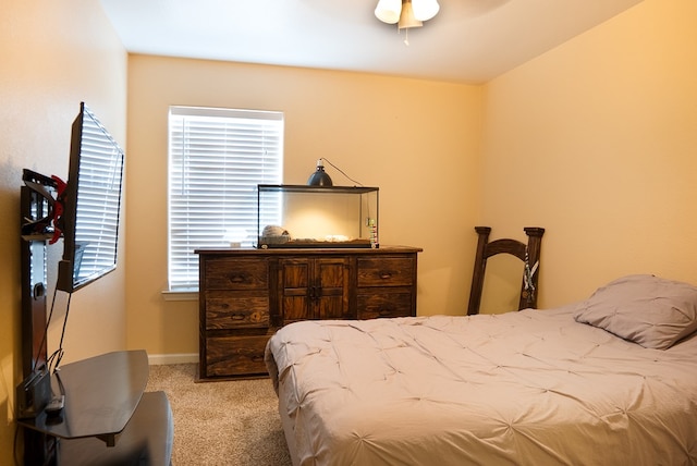 9540 W April St, Odessa, TX 79764 - carpeted bedroom with baseboards and a ceiling fan