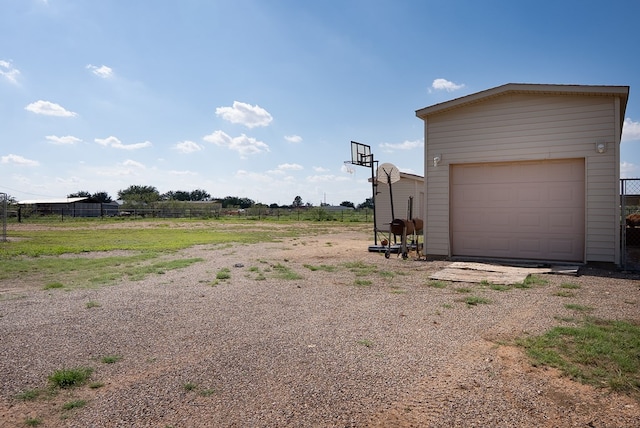 9540 W April St, Odessa, TX 79764 - view of yard featuring driveway and an outdoor structure
