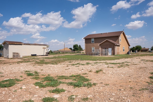 9540 W April St, Odessa, TX 79764 - rear view of house featuring stucco siding