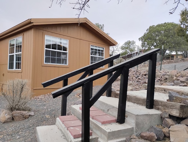 exterior space with stairway and fence