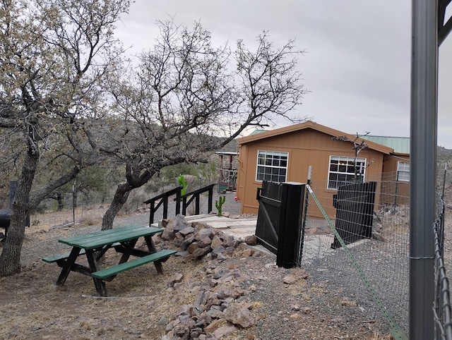 view of home's exterior with an outdoor structure