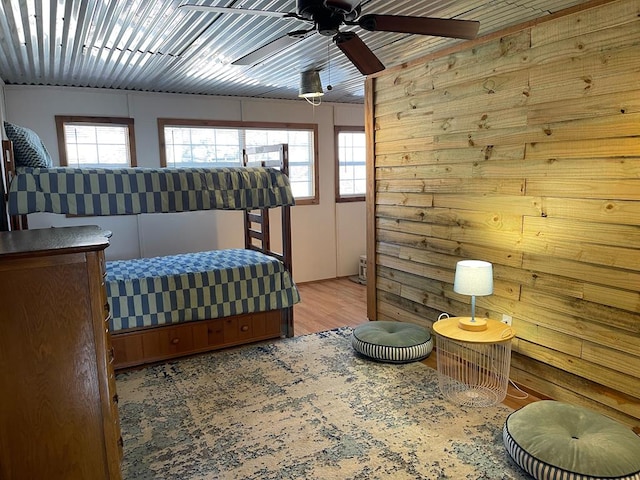 bedroom with wood finished floors and a ceiling fan