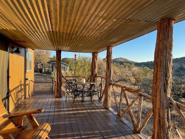 wooden deck with outdoor dining area