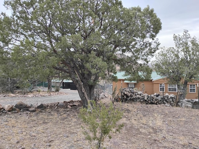 view of front of home featuring fence