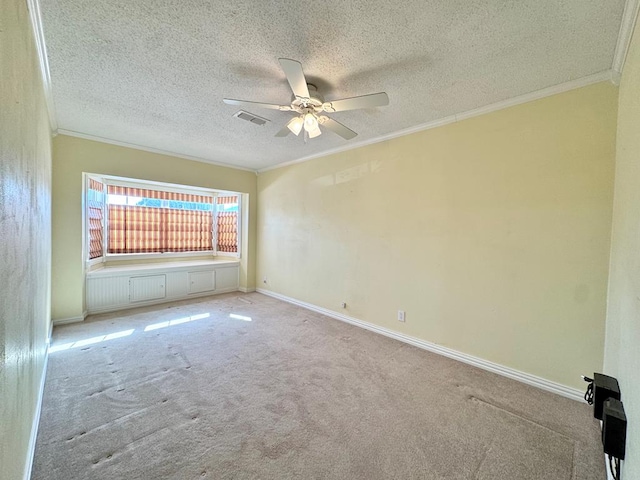 2003 N Enfield Rd, Alpine, TX 79830 - carpeted spare room featuring ornamental molding, ceiling fan, a textured ceiling, and baseboards