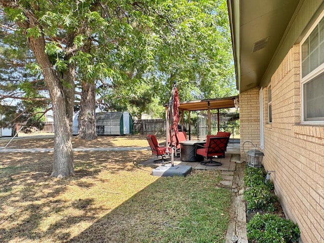 2003 N Enfield Rd, Alpine, TX 79830 - fenced backyard with a patio and a fire pit