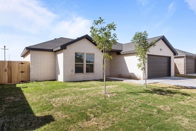 ranch-style house with fence, an attached garage, a front lawn, brick siding, and driveway