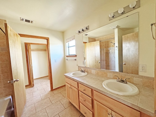 1106 W Eagle Pass, Alpine, TX 79830 - full bath featuring a tile shower, double vanity, tile patterned floors, and baseboards