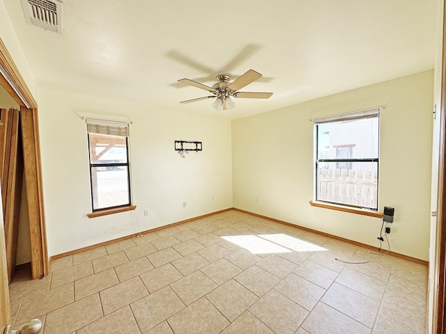 1106 W Eagle Pass, Alpine, TX 79830 - spare room with a ceiling fan, light tile patterned flooring, and baseboards