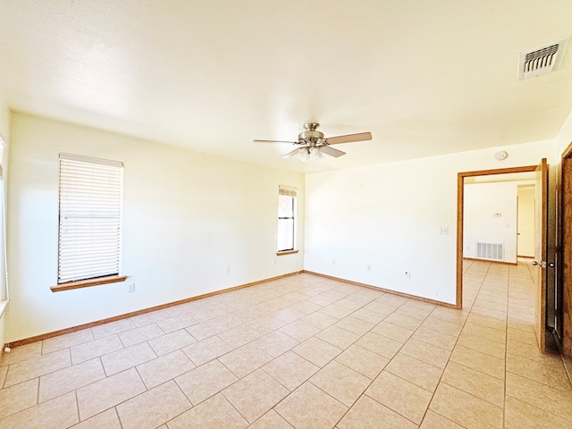 1106 W Eagle Pass, Alpine, TX 79830 - unfurnished room with a ceiling fan, baseboards, and light tile patterned flooring
