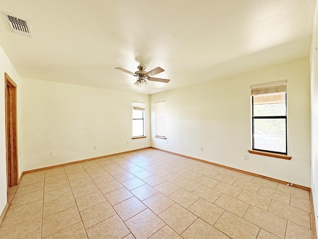 1106 W Eagle Pass, Alpine, TX 79830 - empty room with ceiling fan, light tile patterned floors, and baseboards