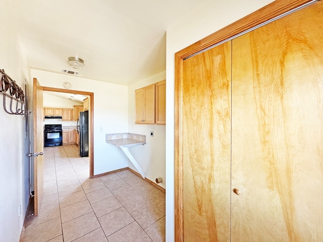 1106 W Eagle Pass, Alpine, TX 79830 - corridor with light tile patterned flooring and baseboards