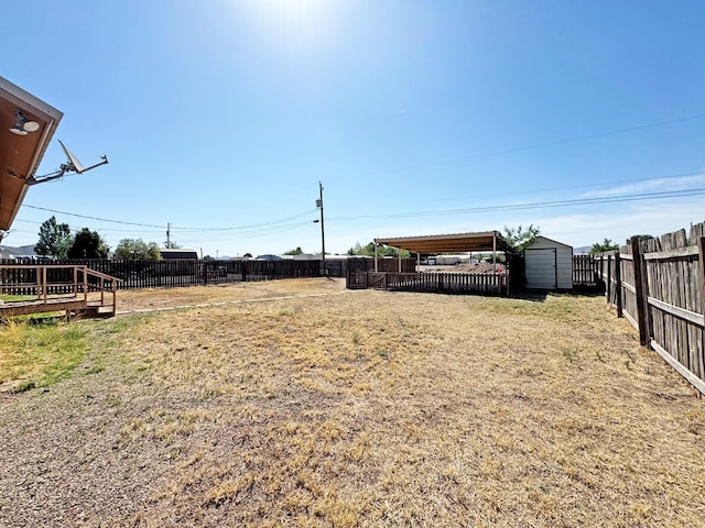 1106 W Eagle Pass, Alpine, TX 79830 - fenced backyard with a storage unit and an outdoor structure
