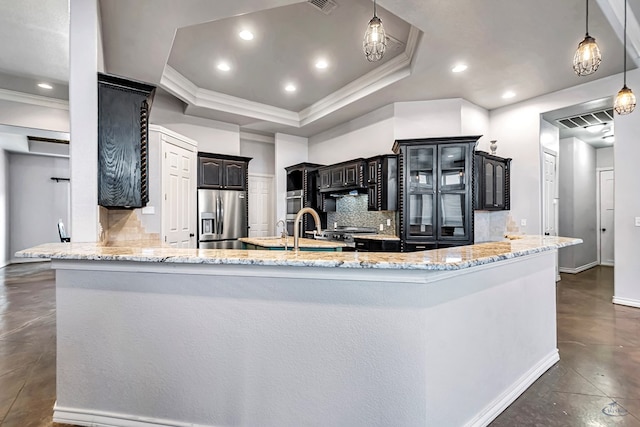3 E Wavyleaf Ct, Odessa, TX 79762 - kitchen with stainless steel refrigerator with ice dispenser, finished concrete floors, a tray ceiling, tasteful backsplash, and light stone countertops