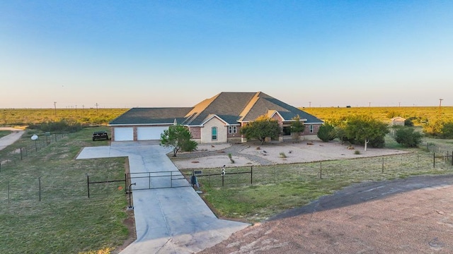 3 E Wavyleaf Ct, Odessa, TX 79762 - ranch-style house with a gate, driveway, and a view of rural / pastoral area