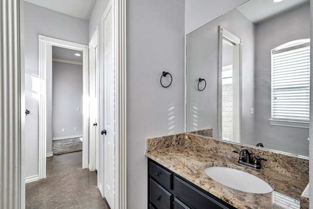 3 E Wavyleaf Ct, Odessa, TX 79762 - bathroom featuring vanity, baseboards, and finished concrete flooring