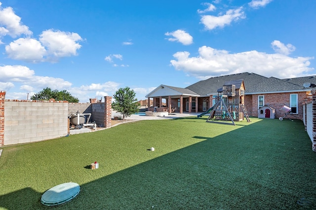 3 E Wavyleaf Ct, Odessa, TX 79762 - view of grassy yard with a playground and a patio