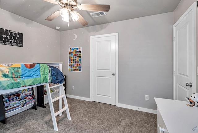 1320 E 94th St, Odessa, TX 79765 - carpeted bedroom with baseboards and a ceiling fan
