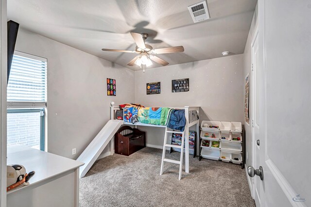 1320 E 94th St, Odessa, TX 79765 - carpeted bedroom with a ceiling fan
