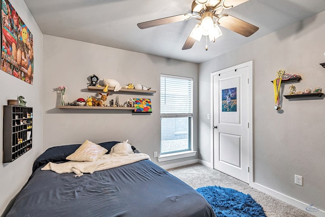 1320 E 94th St, Odessa, TX 79765 - carpeted bedroom with baseboards and ceiling fan