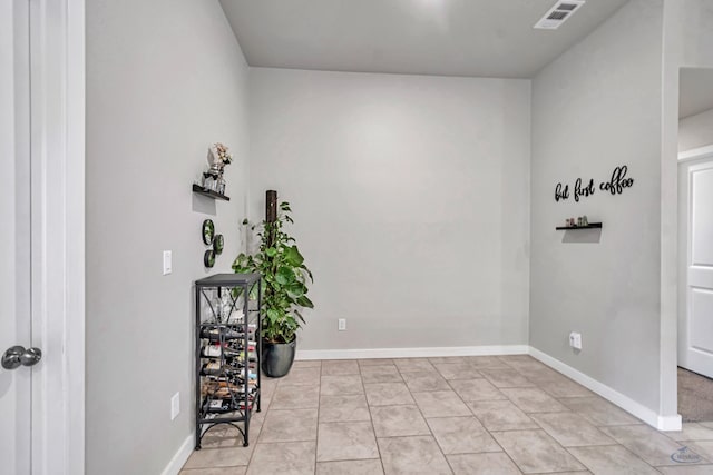1320 E 94th St, Odessa, TX 79765 - miscellaneous room featuring baseboards and light tile patterned floors
