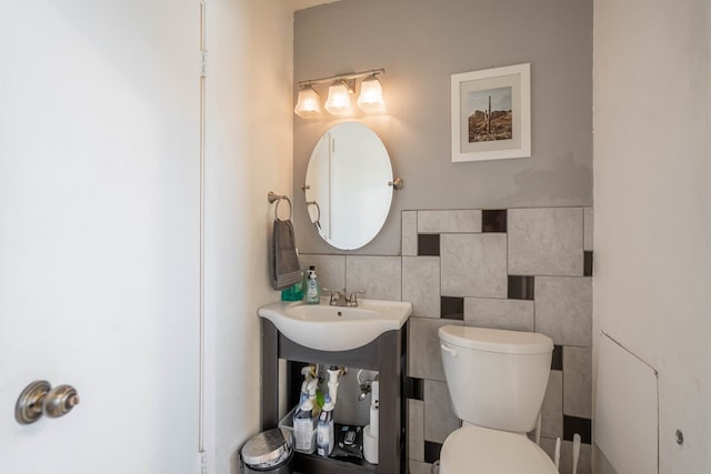 1714 E 53rd St, Odessa, TX 79762 - bathroom featuring tile walls and toilet