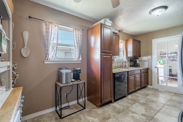 1714 E 53rd St, Odessa, TX 79762 - kitchen with dishwasher, light countertops, healthy amount of natural light, a textured ceiling, and a ceiling fan