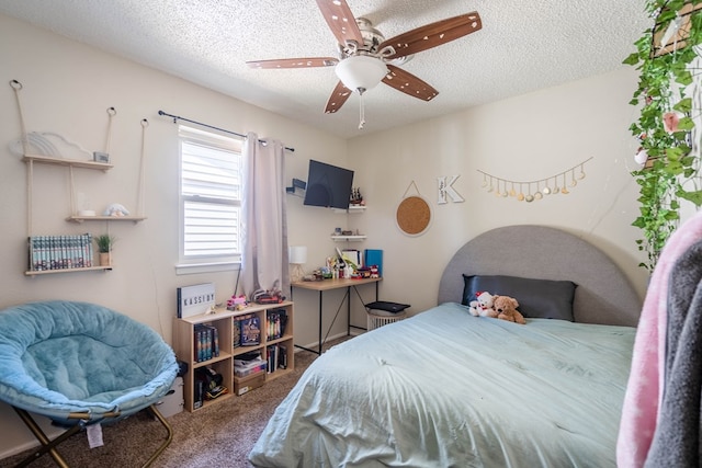 1714 E 53rd St, Odessa, TX 79762 - carpeted bedroom with a textured ceiling and a ceiling fan