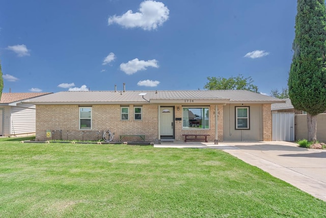 1714 E 53rd St, Odessa, TX 79762 - ranch-style house with brick siding and a metal roof