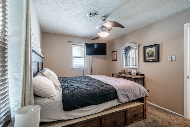 1714 E 53rd St, Odessa, TX 79762 - carpeted bedroom featuring a textured ceiling and a ceiling fan