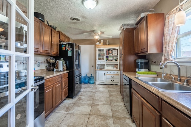 1714 E 53rd St, Odessa, TX 79762 - kitchen featuring stainless steel range with electric cooktop, a ceiling fan, brown cabinets, dishwasher, and light countertops