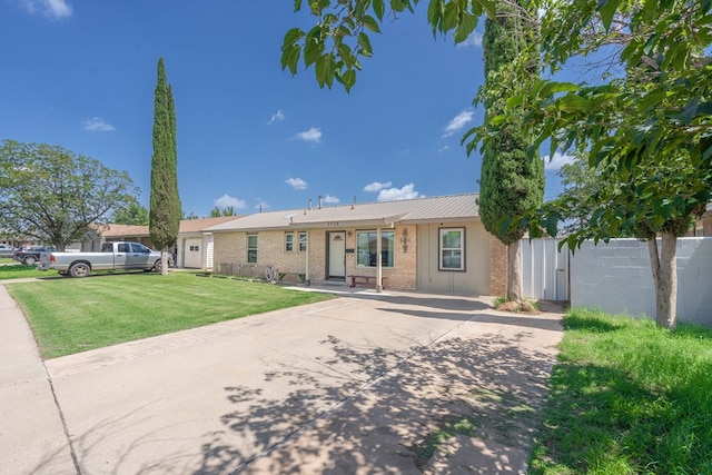 1714 E 53rd St, Odessa, TX 79762 - single story home featuring brick siding and a front lawn