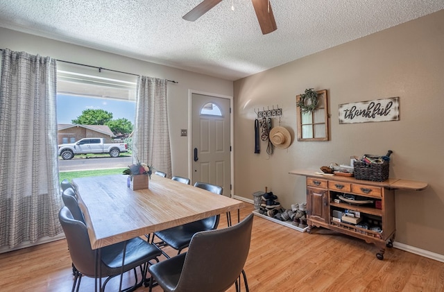 1714 E 53rd St, Odessa, TX 79762 - dining room featuring light wood finished floors, a ceiling fan, and a textured ceiling