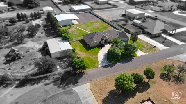 aerial view of property and surrounding area featuring property parcel outlined