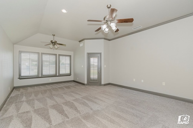 empty room with ceiling fan, light carpet, lofted ceiling, and baseboards