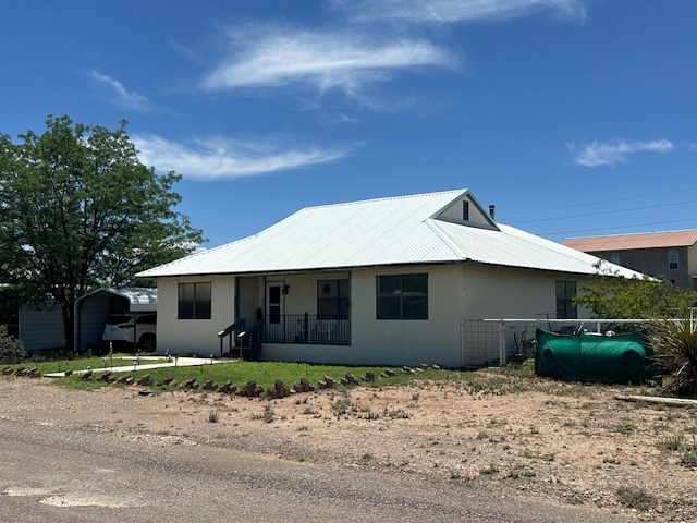 1013 Peachtree Cir, Alpine, TX 79830 - view of front of property with oil tank and a porch
