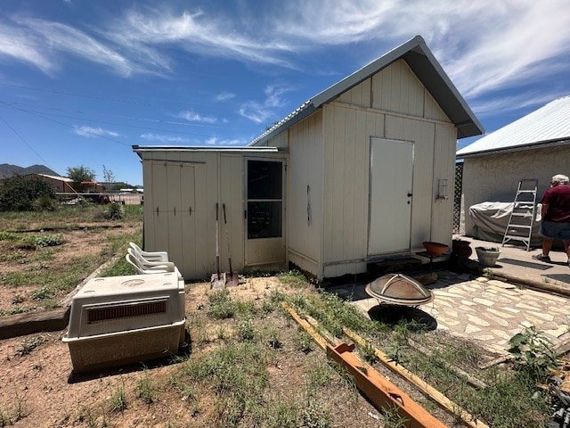 1013 Peachtree Cir, Alpine, TX 79830 - view of shed with an outdoor fire pit