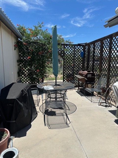 1013 Peachtree Cir, Alpine, TX 79830 - view of patio featuring outdoor dining space and area for grilling