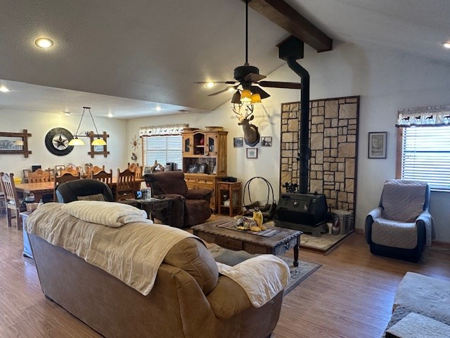 1013 Peachtree Cir, Alpine, TX 79830 - living area with a wood stove, ceiling fan, wood finished floors, and recessed lighting
