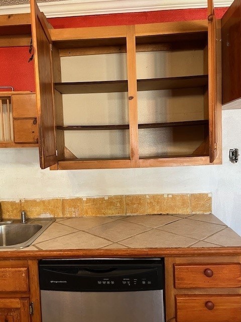 kitchen featuring stainless steel dishwasher and sink