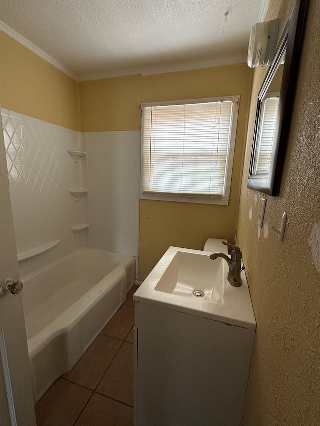 bathroom featuring tile patterned flooring, vanity, bathing tub / shower combination, and a textured ceiling