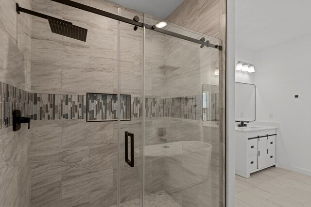 12645 W Maria Dr, Odessa, TX 79764 - full bathroom featuring vanity, a shower stall, and baseboards