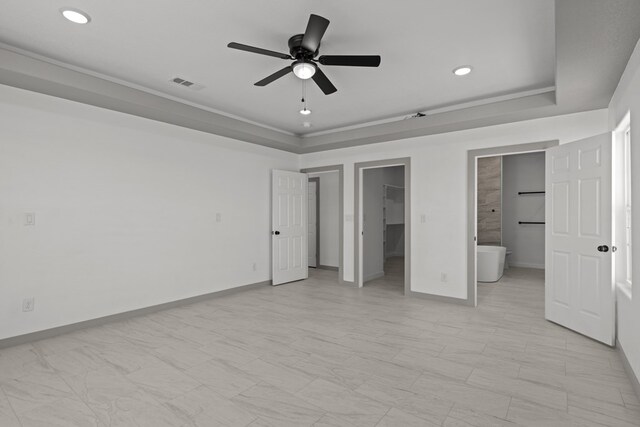 12645 W Maria Dr, Odessa, TX 79764 - unfurnished bedroom featuring recessed lighting, a spacious closet, a raised ceiling, baseboards, and ceiling fan