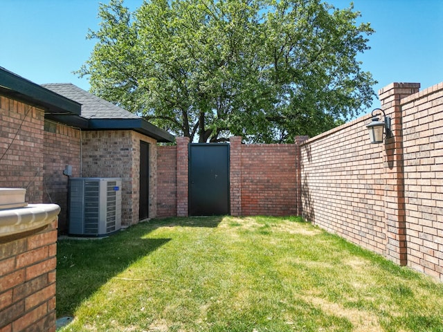 10 Lafayette Pl, Odessa, TX 79762 - view of yard with cooling unit and a gate